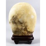 A GOOD 19TH / 20TH CENTURY CHINESE CARVED HARDSTONE SCHOLARS OBJECT, on its fitted wooden base, 35cm