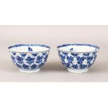 A PAIR OF 18TH CENTURY CHINESE KANGXI BLUE & WHITE PORCELAIN BOWLS, each bowl with moulded