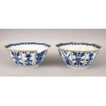 A PAIR OF 19TH CENTURY JAPANESE KANGXI STYLE BLUE & WHITE PORCELAIN BOWLS, with panel decoration