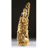 A GOOD JAPANESE MEIJI PERIOD CARVED IVORY OKIMONO GROUP - SCHOLAR AND WOMAN, The man stood tall with