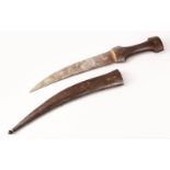 AN EARLY QAJAR STEEL DAGGER, the sheath carved with scrolling foliage, the blade with traces of