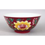 A GOOD CHINESE CORAL GROUND FAMILLE ROSE PORCELAIN BOWL, the body of the bowl with formal