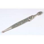 A FINE WHITE METAL CAUCASIAN ISLAMIC KINJAL DAGGER, with a decorated front side, 33cm long.