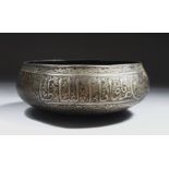 A GOOD EARLY ISLAMIC BRONZE CIRCULAR BOWL, engraved with calligraphy, 16cm diameter.