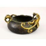 A 20TH CENTURY CHINESE BRONZE TWIN HANDLE CENSER, the censer with moulded gilded handles in the form