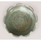 A CHINESE MOULDED RU WARE DISH, the dish with moulded lip, the interior with moulded decoration,