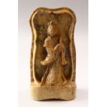 A 19TH CENTURY CHINESE CARVED SOAPSTONE FIGURE OF GUANYIN, stood in a carved housing, holding a