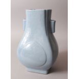 A CHINESE PALE BLUE PORCELAIN HU VASE, the base with a six-character mark, 31cm high.