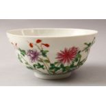 A GOOD CHINESE FAMMILE ROSE PORCELAIN BOWL, decorated with native floral scenes, the base with an