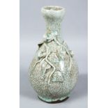 A GOOD CHINESE CRACKLE GLAZED & MOULDED PORCELAIN VASE, the pale celadon ground with crackle