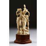 A GOOD 19TH CENTURY CARVED INDIAN IVORY FIGURE OF DANCERS, stood in a semi nude dancing pose,