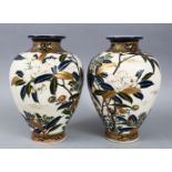 A GOOD PAIR OF JAPANESE IMPERIAL SATSUMA PORCELAIN VASES, each decorated with sprays of native flora