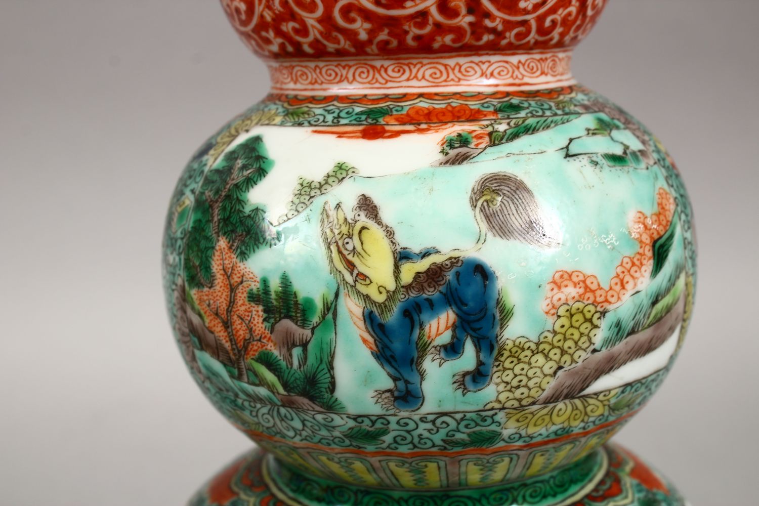 A PAIR OF CHINESE FAMILLE VERTE TRIPLE GOURD PORCELAIN VASES, decorated with panels of lion dogs - Image 6 of 9