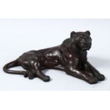 A GOOD JAPANESE MEIJI PERIOD BRONZE OKIMONO OF A RECUMBENT TIGER, in a recumbent position with its