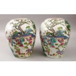 A PAIR OF 19TH CENTURY CHINESE FAMILLE ROSE PORCELAIN JARS, decorated with scenes of figures in