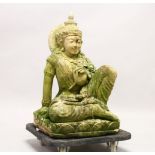 A LARGE 19TH CENTURY IDIAN CARVED SANDSTONE FIGURE OF BUDDHA, in a seated position, 69cm high x 42cm