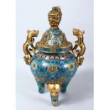 A GOOD CHINESE CLOISONNE TRIPOD CENSER AND COVER, the censer with twin gilt lion dog handles, the