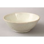 A GOOD CHINESE DING WARE PORCELAIN BOWL, the exterior of the bowl carved 11.5cm diameter.