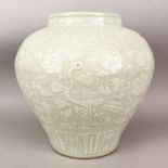 A LARGE CHINESE MING STYLE CARVED CELADON PORCELAIN JAR / VASE, the body of the vase with carved