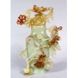 A GOOD 19TH CENTURY CHINESE CARVED JADE VASE AND COVER, the vase with carved detailed flora and