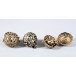 THREE CHINESE WHITE METAL PIERCED INCENSE BURNING BALLS, carved with phoenix amongst lotus, 6cm
