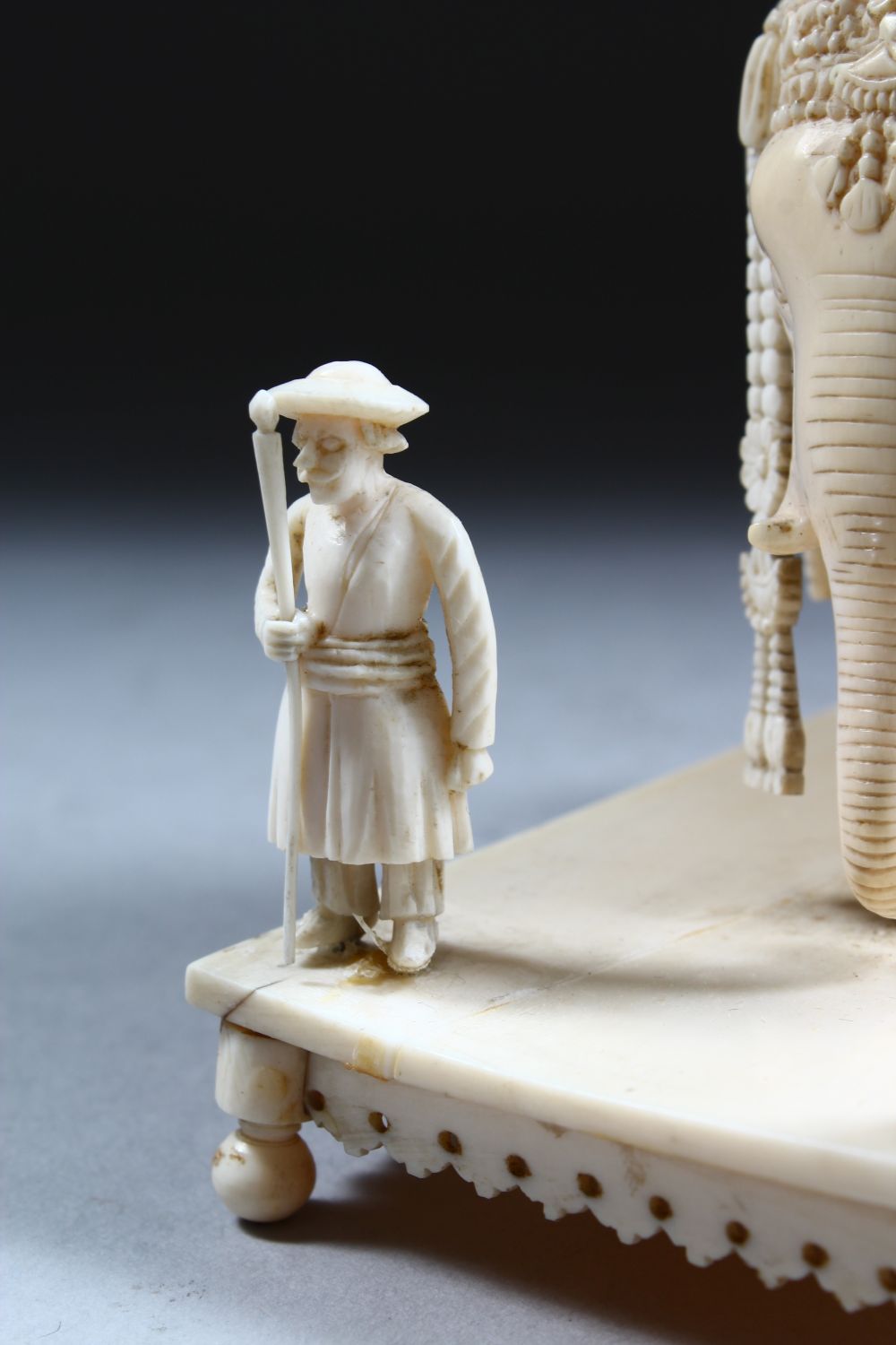 A 19TH CENTURY INDIAN CARVED IVORY FIGURE OF AN ELEPHANT AND ATTENDANTS, in a striding position with - Image 7 of 9