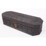 AN 18TH CENTURY CEYLONESE CARVED EBONY LIDDED BOX, the box carved in great detail all round with