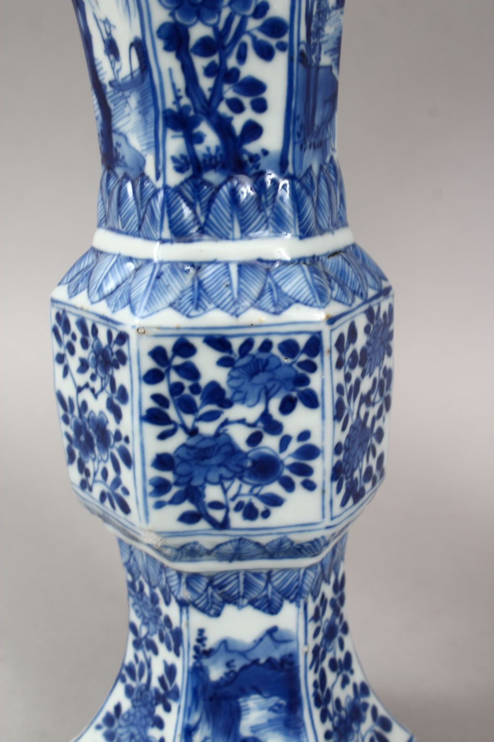 A GOOD PAIR OF 18TH CENTURY CHINESE KANGXI BLUE & WHITE GU SHAPE PORCELAIN VASES, with a multitude - Image 7 of 10