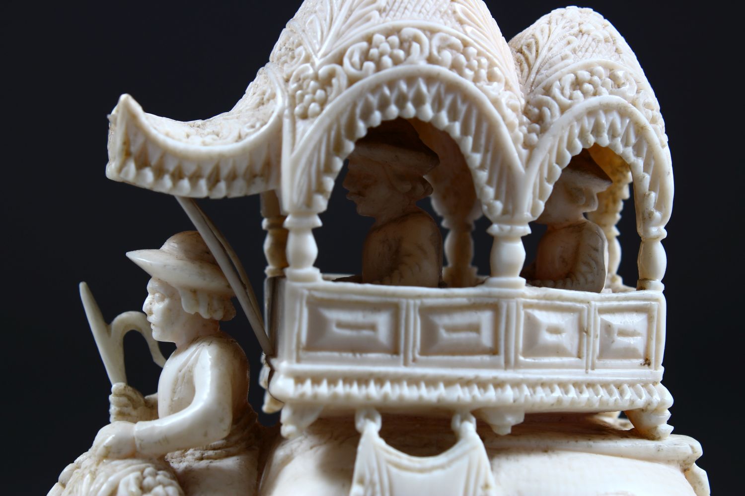 A 19TH CENTURY INDIAN CARVED IVORY FIGURE OF AN ELEPHANT AND ATTENDANTS, in a striding position with - Image 8 of 9