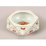 A CHINESE GUANGXU DIAMOND FORM FAMILLE ROSE PORCELAIN BRUSH WASHER, the interior with an iron red