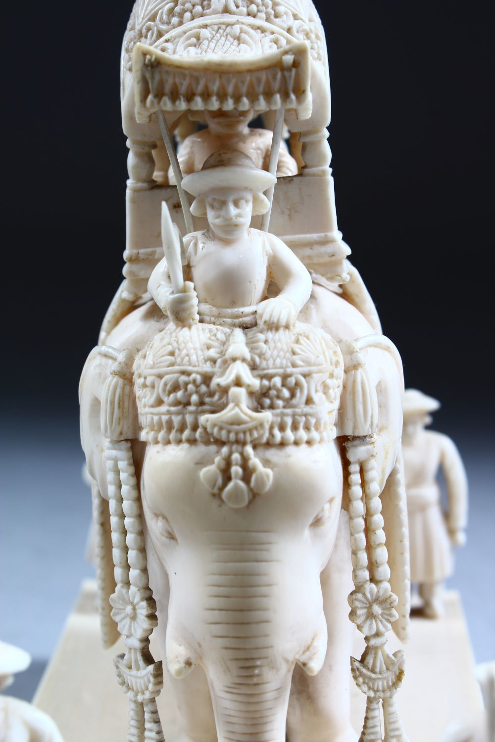 A 19TH CENTURY INDIAN CARVED IVORY FIGURE OF AN ELEPHANT AND ATTENDANTS, in a striding position with - Image 9 of 9