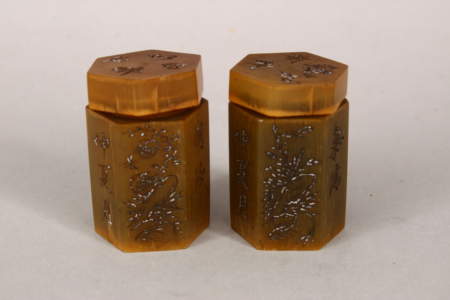 A PAIR OF 19TH CENTURY CHINESE RHINO HORN & SILVER MEDICINE BOTTLES