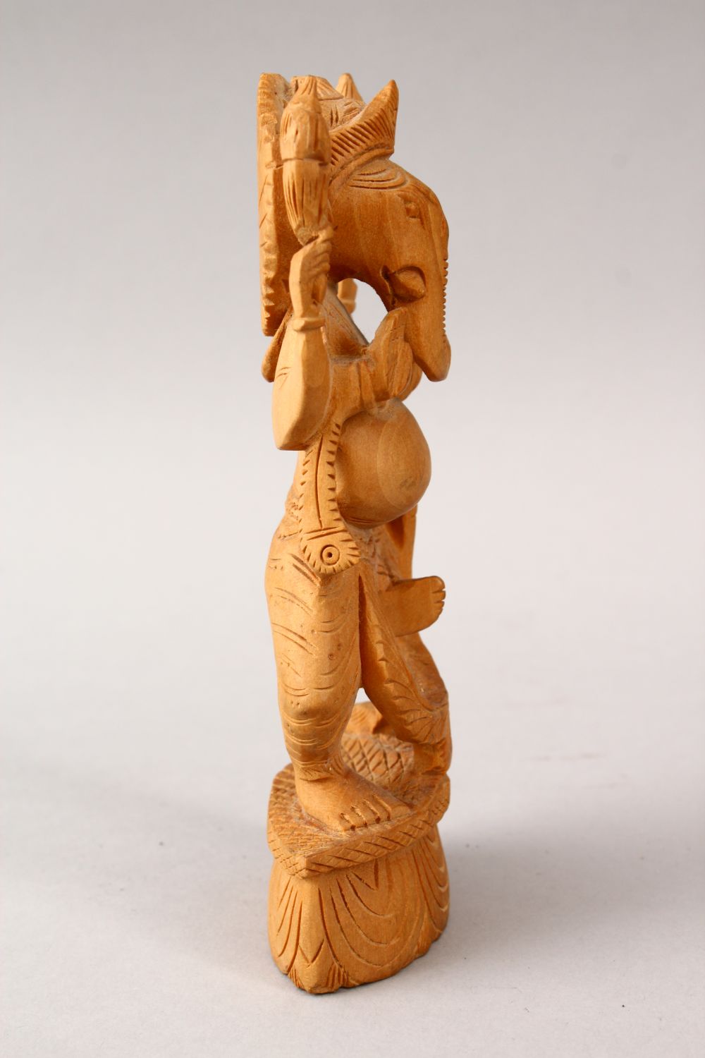 A 20TH CENTURY CARVED WOODEN INDIAN FIGURE OF GANESH, stood upon a carved base, 16cm high - Image 2 of 4