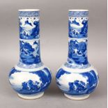 A PAIR OF CHINESE BLUE & WHITE PORCELAIN VASES, the body of the vases with paneled scenes of figures