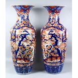 A LARGE PAIR OF 19TH CENTURY JAPANESE IMARI PORCELAIN VASES, the body of the vases decorated in