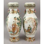 A GOOD PAIR OF JAPANESE MEIJI PERIOD KUTANI SATSUMA DECORATED VASES, with twin moulded floral