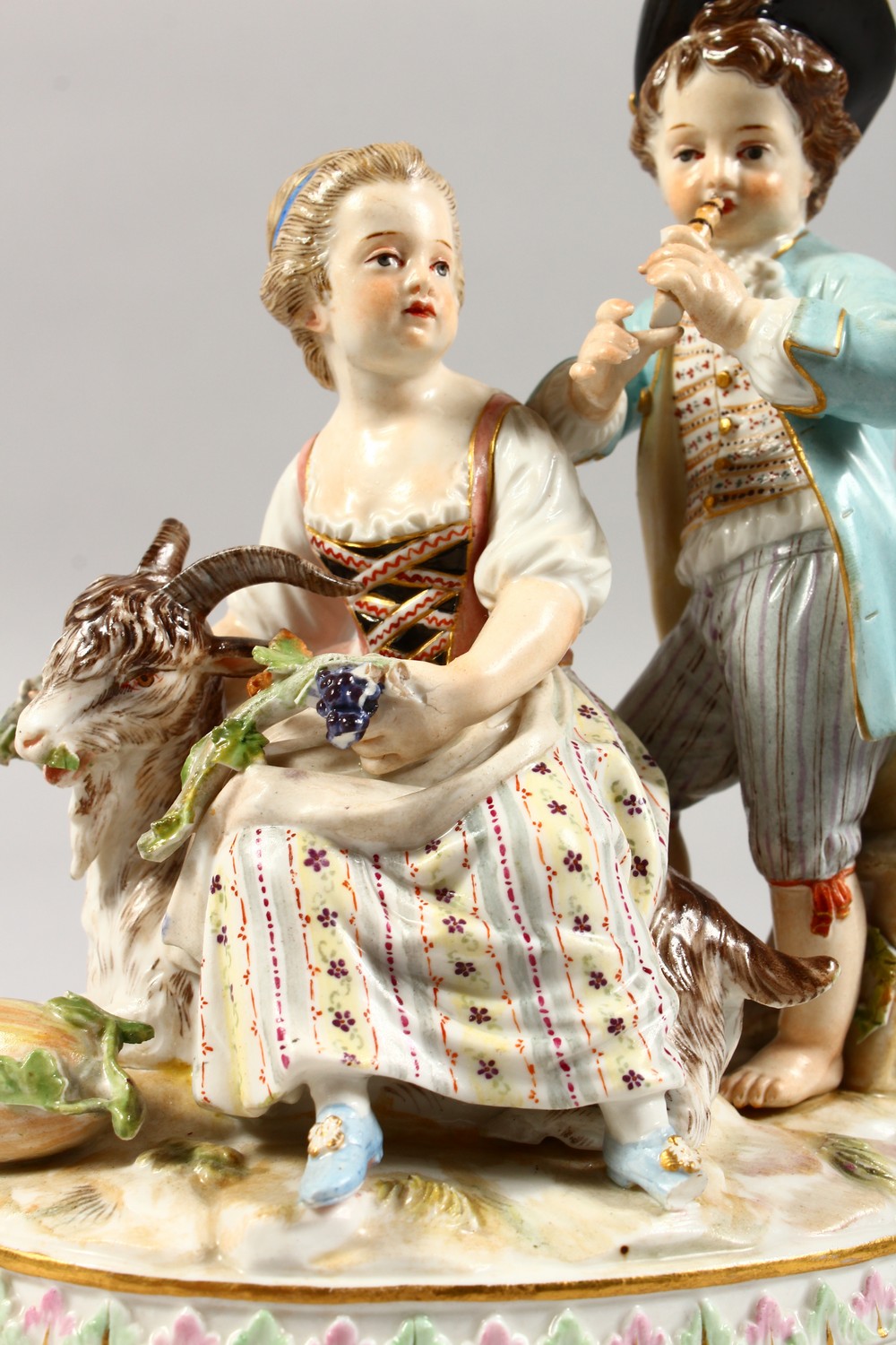 A 19TH CENTURY MEISSEN PORCELAIN GROUP OF A BOY AND GIRL, with goat and fruiting vines. Cross swords - Image 3 of 10