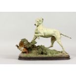 JULES PAUTROT (MID 19TH CENTURY) FRENCH A PAINTED BRONZE OF A DOG, pulling up a pheasant. Signed