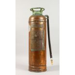AN OLD COPPER FIRE EXTINGUISHER. 23.5ins high.