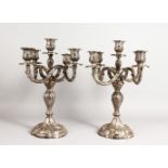 A PAIR OF ROCOCO STYLE SILVER FIVE LIGHT CANDELABRA, each with four scrolling arms. Stamped 925