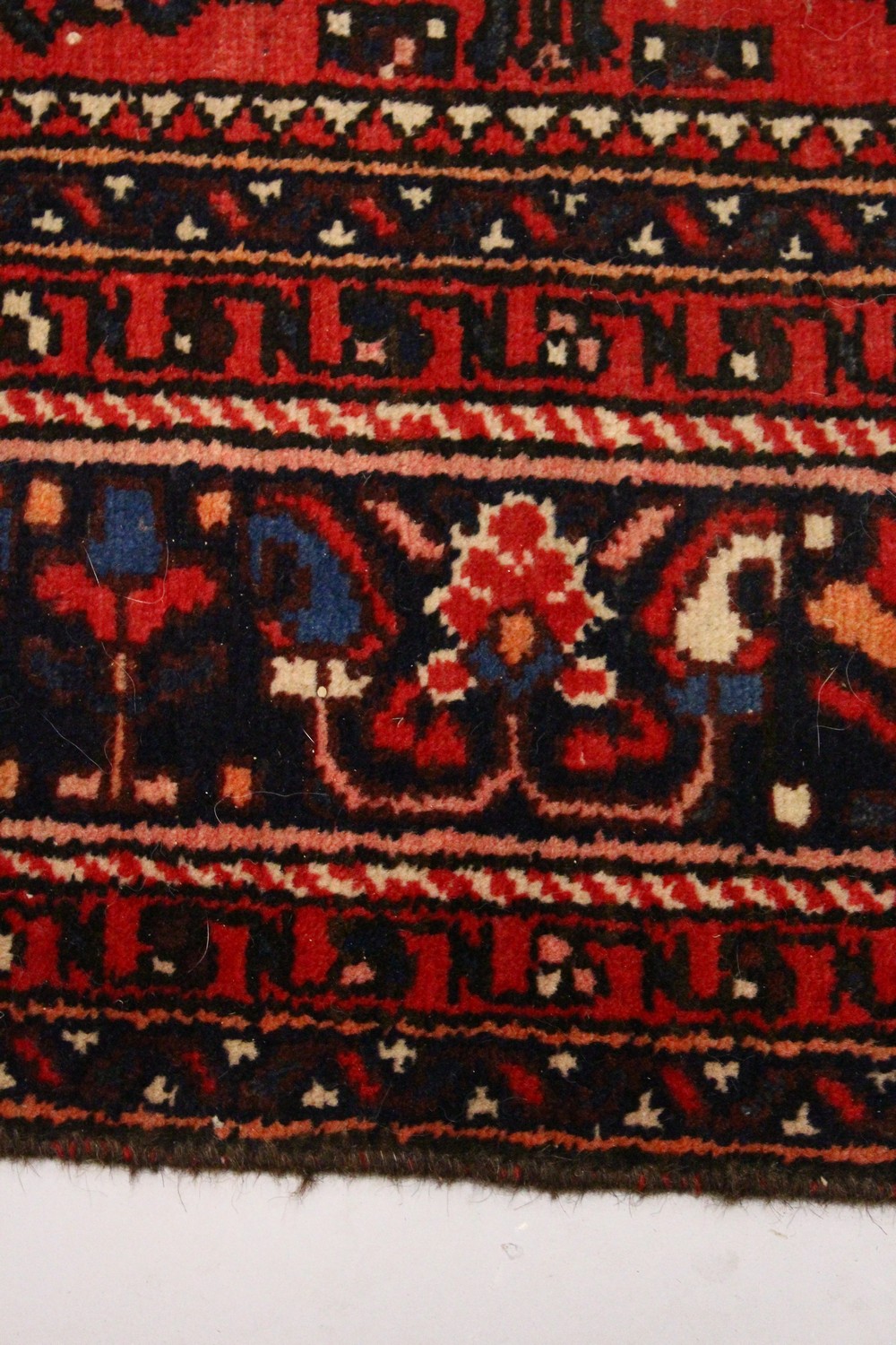 A PERSIAN RUG, 20TH CENTURY, red ground with central medallion, within a dark blue border. 6ft - Image 8 of 11