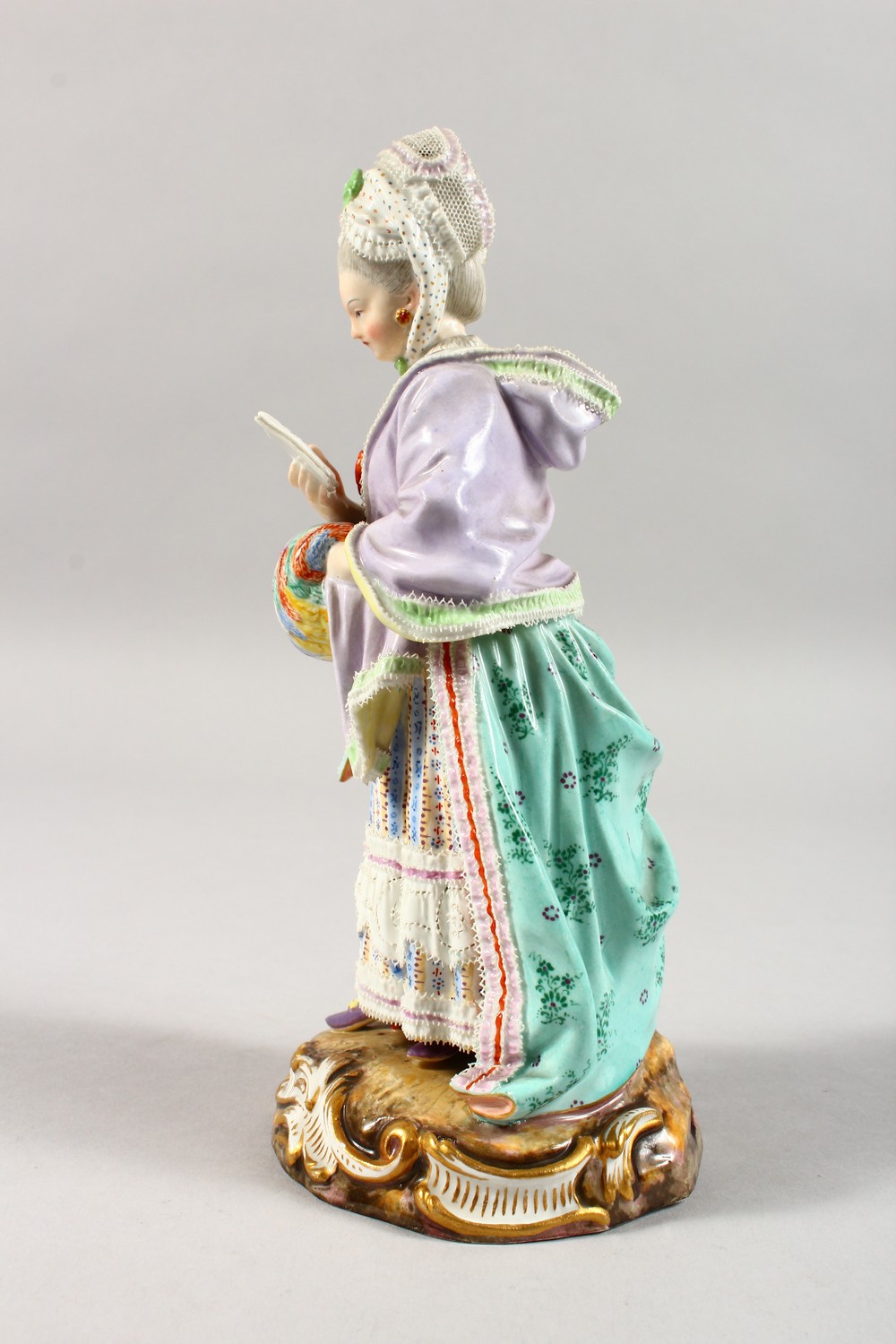 A GOOD 19TH CENTURY MEISSEN PORCELAIN FIGURE OF A LADY with muff, reading a book. Cross swords - Image 9 of 14