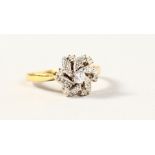 AN 18CT WHITE GOLD DIAMOND FLOWER RING.