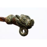 A ROMAN METAL HOOK with animal head.