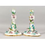 A GOOD PAIR OF 19TH CENTURY MEISSEN CANDLESTICKS, with scrolls, painted and encrusted with flowers