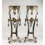 A GOOD PAIR OF SILVER PLATED GUERIDONS, with ornate hanging tassels, lion mask mounts, on four