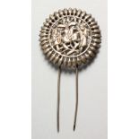 A SMALL PIERCED SILVER HAIRPIN. 1.75ins diameter.