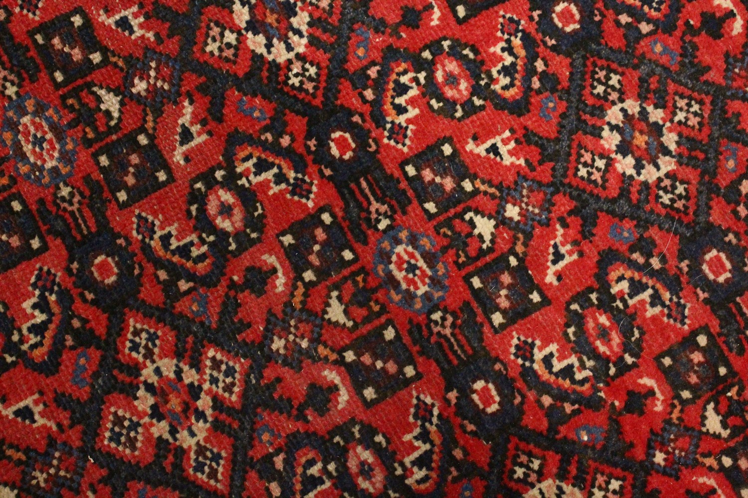 A PERSIAN RUG, 20TH CENTURY, red ground with central medallion, within a dark blue border. 6ft - Image 6 of 11