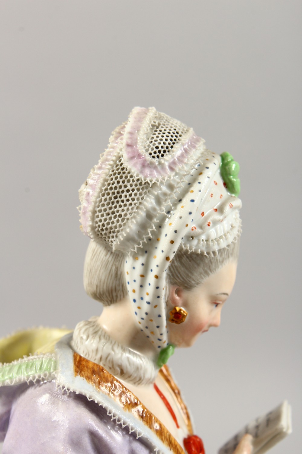 A GOOD 19TH CENTURY MEISSEN PORCELAIN FIGURE OF A LADY with muff, reading a book. Cross swords - Image 5 of 14