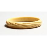 AN IVORY BANGLE.